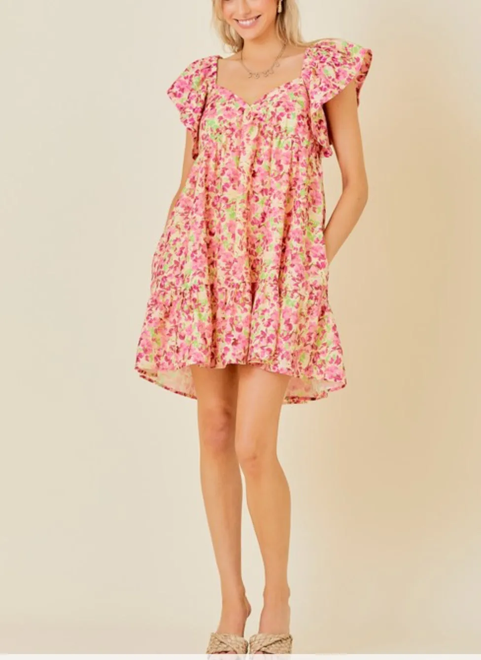 Butter Pink floral mini dress with tie back and ruffle sleeves and side pockets