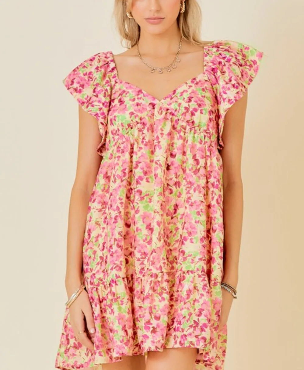 Butter Pink floral mini dress with tie back and ruffle sleeves and side pockets